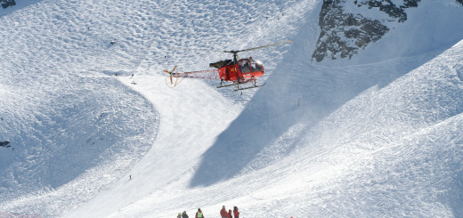 A helicopter flies through a run in Verbier, Switzerland.